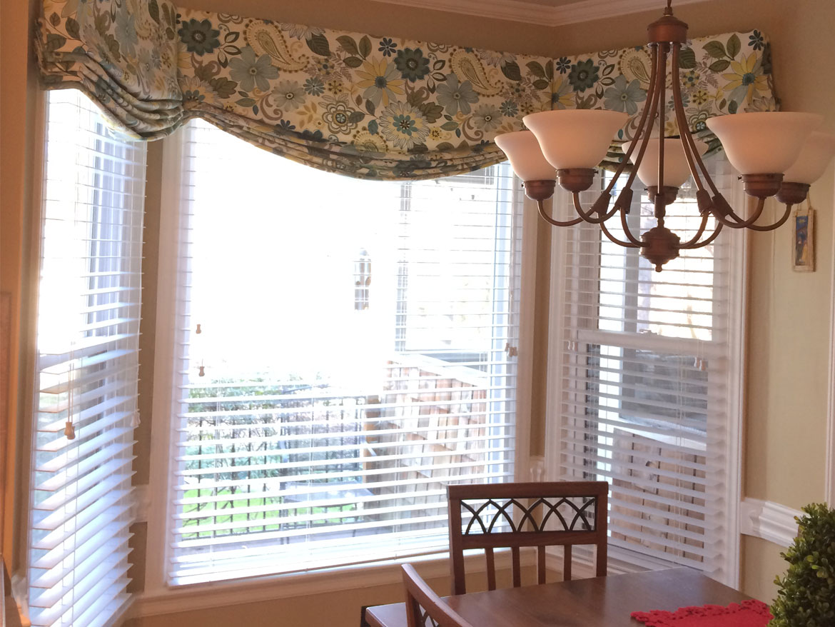 Floral and paisley bay window treatment