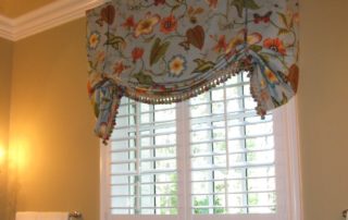 Plantation shutters paired with a valance