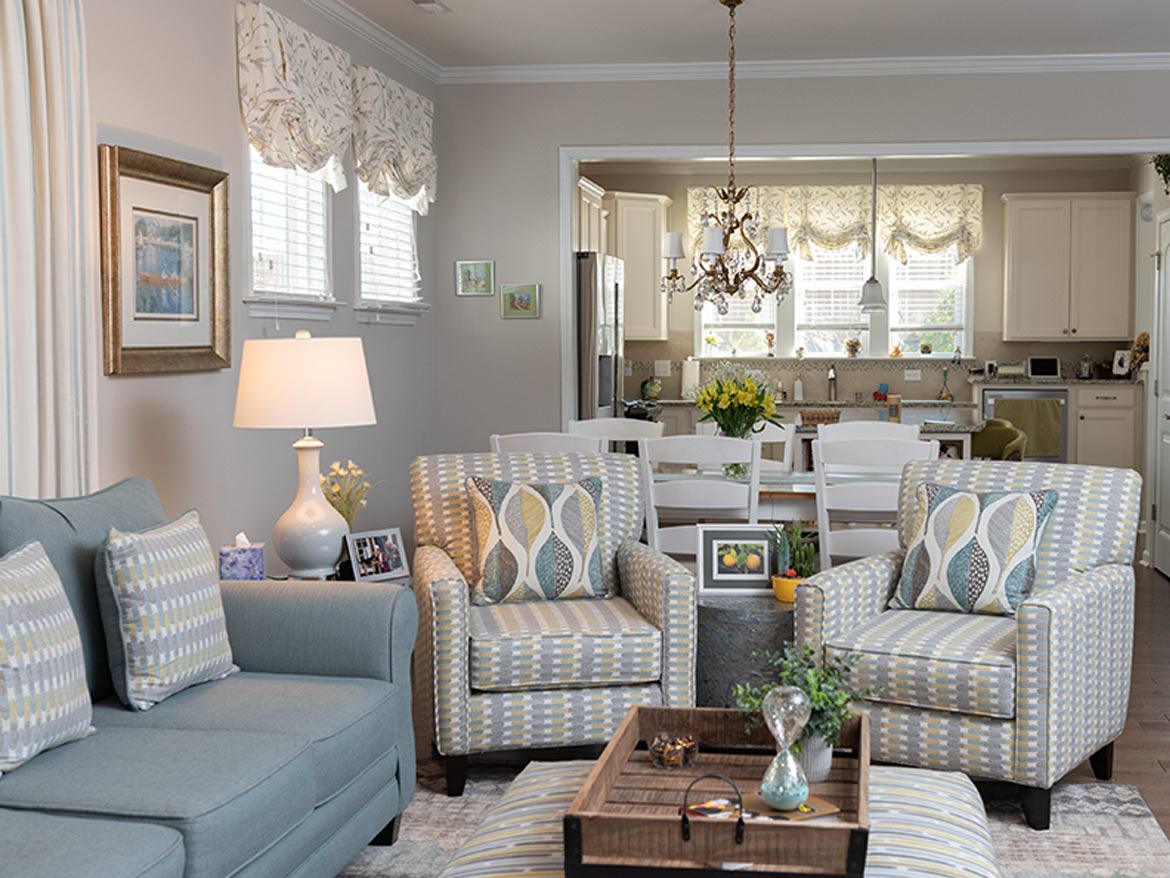 A living room with couches and a table.