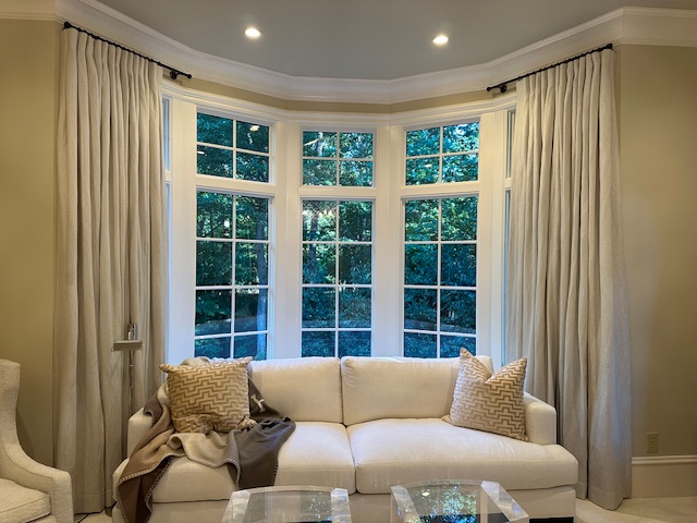 Custom draperies in a bay window