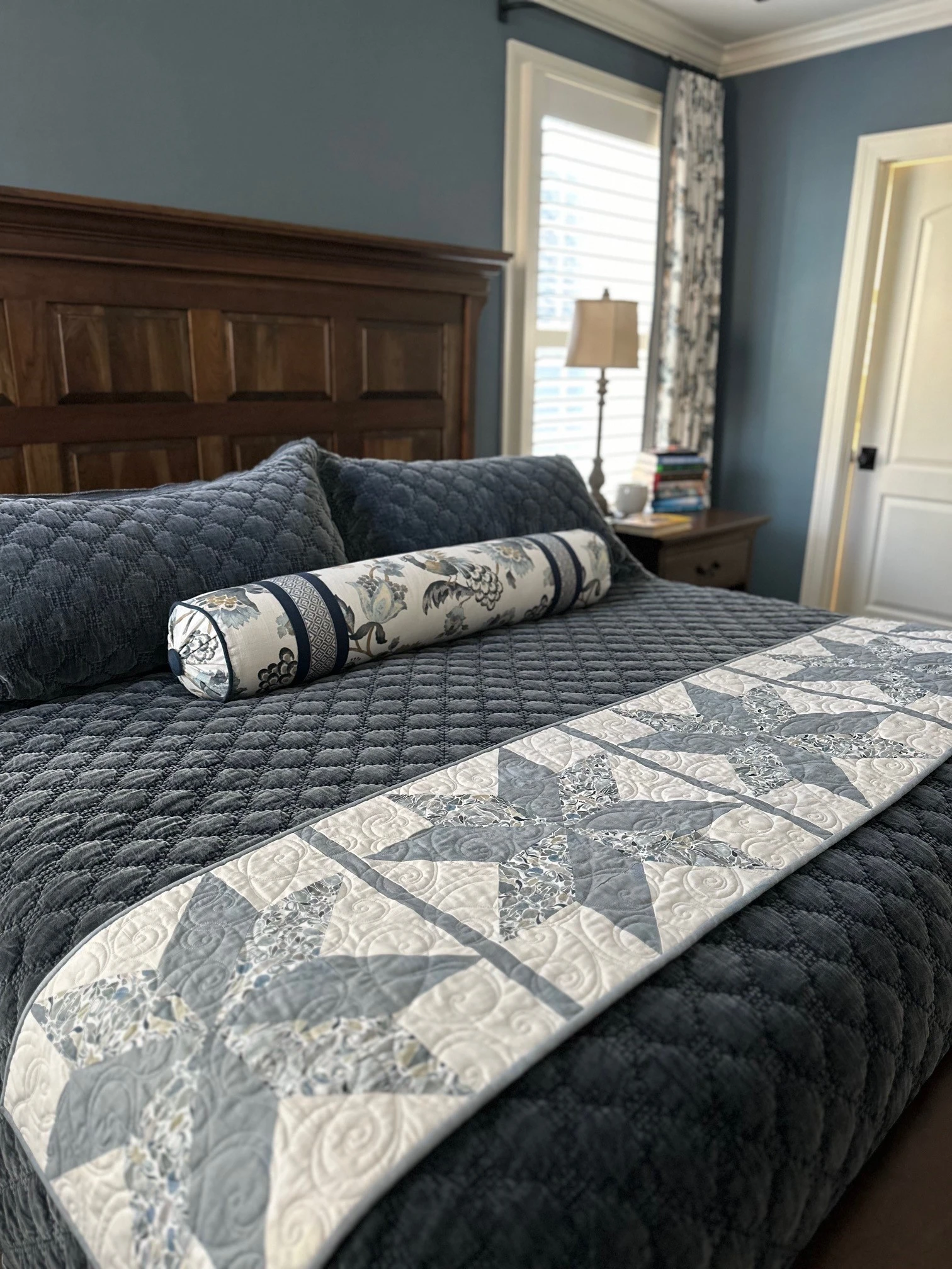 Bed with quilt and custom pillows