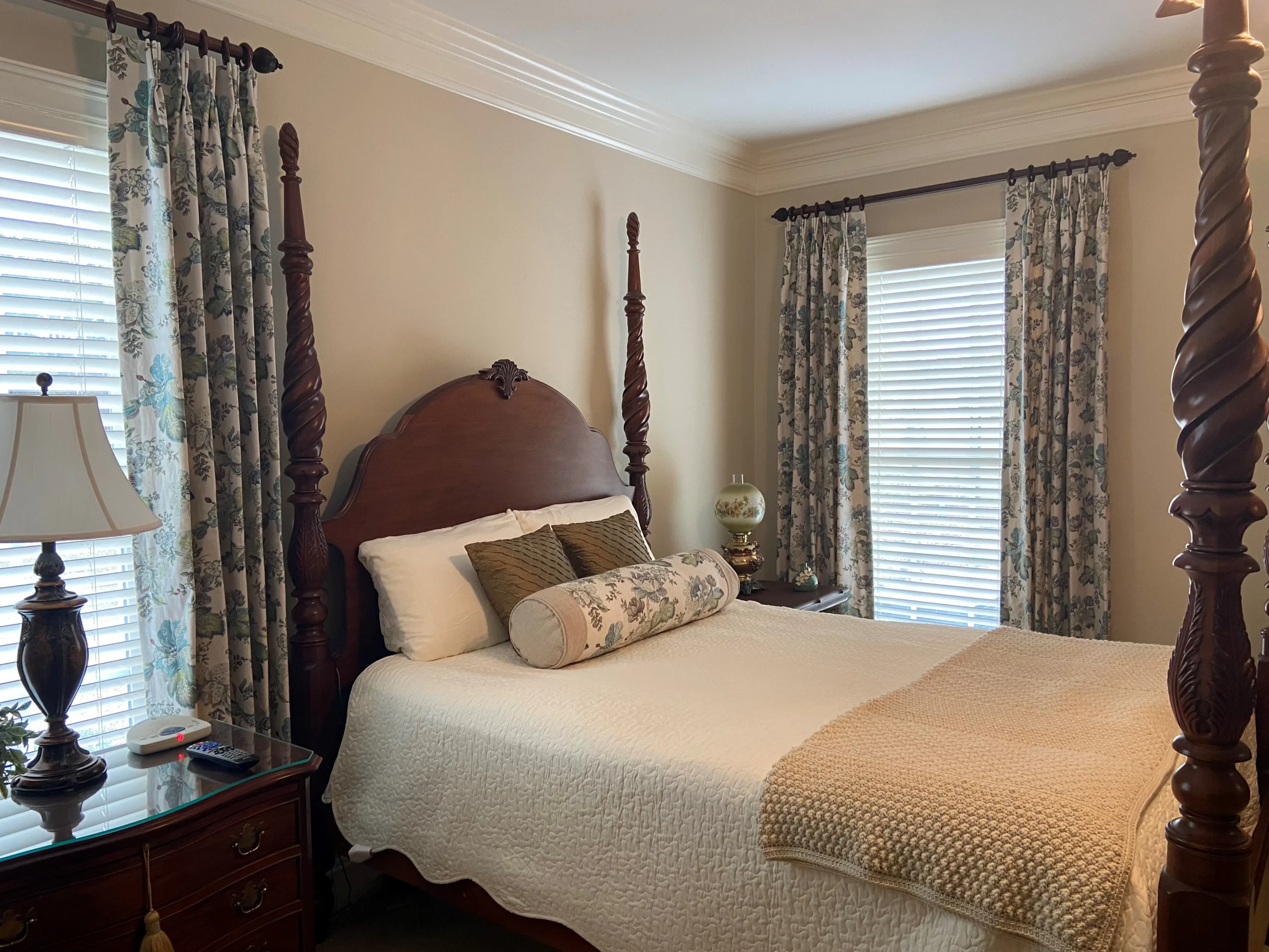 Bedroom with custom draperies and matching decorative pillows
